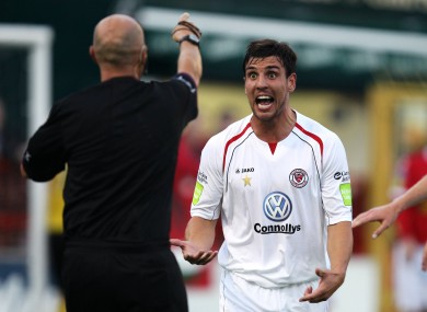 Gavin Peers reacts towards referee Paul Tuite.