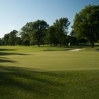 Tree-lined dogleg right to left that presents a partly blind shot off the tee. No bunkers in the landing area, but three around a green that breaks fast from right to left.
