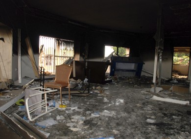 Glass, debris and overturned furniture are strewn inside a room in the gutted US consulate in Benghazi