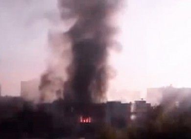 Black smoke rises from Syria's army command headquarters in Damascus, Syria