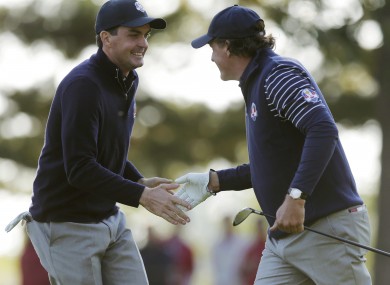 Phil Mickelson, right, and Keegan Bradley react on the seventh hole.