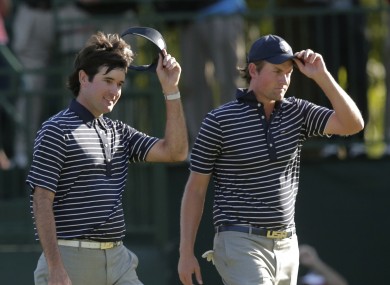 USA's Bubba Watson and Webb Simpson acknowledge the crowd after winning their four-ball match at the Ryder Cup PGA golf tournament.