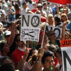 The demonstration was called to protest government cuts during the country's financial crisis. (AP Photo/Andres Kudacki)