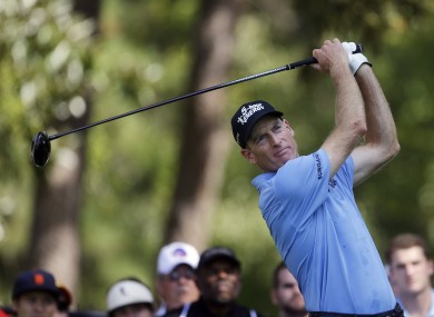 Jim Furyk watches his tee shot on the 13th hole during the second round of play in the Tour Championship golf tournament in Atlanta.