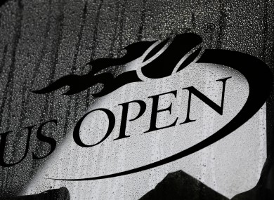 Rain drops gather on a window during a rain delay at the 2012 US Open tennis tournament.