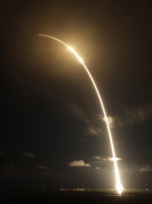 A long-exposure photo shows the Falcon 9 SpaceX rocket lifting off the Cape Canaveral Air Force Station in Cape Canaveral, Florida