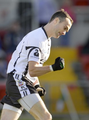 Conor Laverty celebrates his goal for Kilcoo.