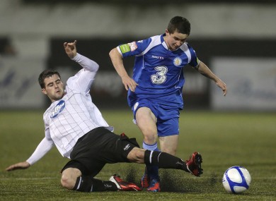 Dundalk's Eoghan Osborne slides in on Man of the Match Sean Maguire.