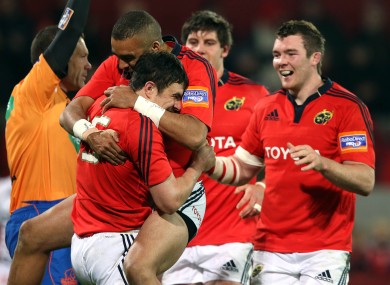 Felix Jones celebrates with Simon Zebo and Peter O'Mahony.