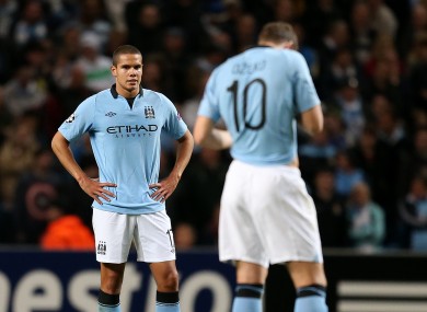 Manchester City's Jack Rodwell stands dejected after his mistake led to Borussia Dortmund's first goal.