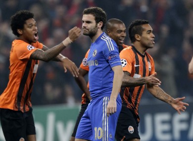 Alex Teixeira of Shakhtar Donetsk, right, celebrates in front of Juan Mata.