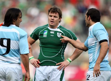 Felipe Contepomi points the finger at Brian O'Driscoll as Puma skipper Augustin Pichot stands by.