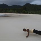 John Sanu, who goes by the nickname B.B., does push-ups on the beach at River No. 2, outside Freetown, Sierra Leone, Sunday, Nov. 18, 2012. Sierra Leoneans chose Saturday between keeping an incumbent president who has expanded health care and paved roads or electing an opposition candidate to lead this war-scarred nation still recovering a decade later despite its mineral riches. Election results were still being compiled on Sunday.(AP Photo/Rebecca Blackwell)