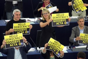 Green MEPs cheer after the European Parliament voted down the controversial Anti-Counterfeit Trade Agreement.