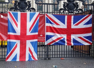 Thousands of loyalists have marched to City Hall in Belfast to protest against the decision to restrict the number of days that the Union flag is flown on the building.