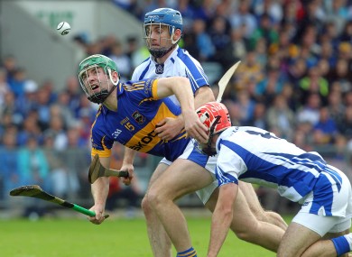Tipperary's Noel McGrath tackled by Michael Walsh and Stephen Daniels of Waterford in the Munster final.