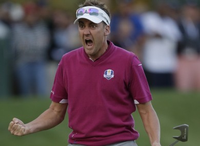 Ian Poulter reacts to a clutch putt disappearing into the 16th hole at Medinah.