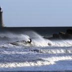 A surfer makes the use of the gales force winds at Ynemouth today. (PA Photo Owen Humphreys)