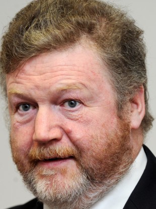Fine Gael Minister for Health, Dr James Reilly with a copy of the report
