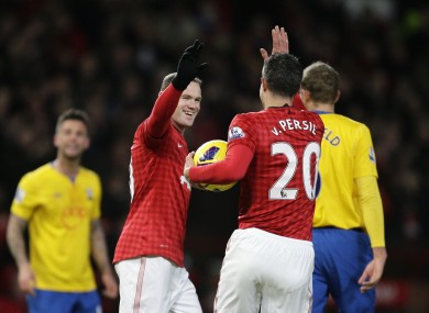 Rooney: celebrates with Robin van Persie.