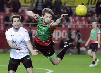 Tommy Barry dives for the ball in last night's game in Seville.