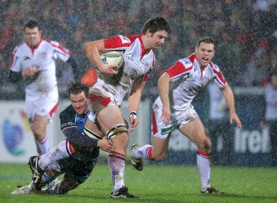 Peter Murchie tries to get a tackle on Iain Henderson.