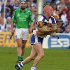 Mullane clears the pitch of a canine invasion as Waterford claim provincial glory against Limerick.