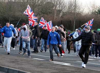 Loyalists react during clashes with nationalists at the Short Strand area of Belfast earlier this month