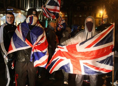 Loyalists confront police in Belfast, a month after the City Council decided to fly the Union flag on designated days only.
