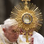 Pope Benedict XVI holds the ostensory as he presides a New Year's Eve vespers service in St. Peter's Basilica at the Vatican. (AP Photo/Andrew Medichini)