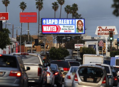 A digital billboard along Santa Monica Boulevard on the west side of Los Angeles shows a