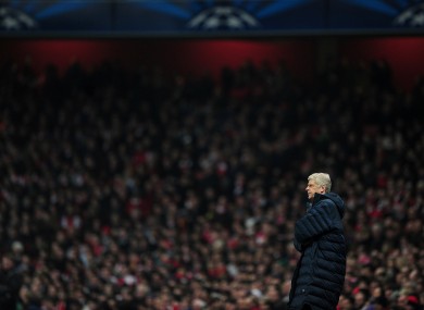 Arsenal manager Arsene Wenger cuts a lone figure on the touchline.