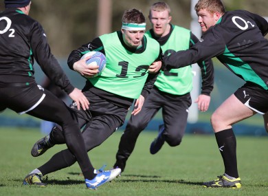 Brian O'Driscoll gets away from Stephen Archer in training.