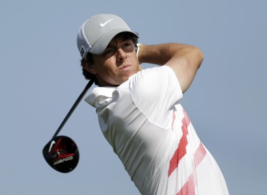 Rory McIlroy watches his tee shot on the 10th hole during the first round of the Honda Classic golf tournament.