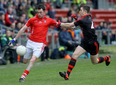 Down's Ryan Boyle with Cork's Donncha O'Connor.