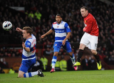 Wayne Rooney slams in a goal for United.